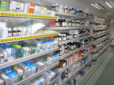 Pharmacy shelving units stocked with medicines